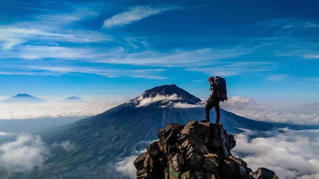 a person on the top of a mountain