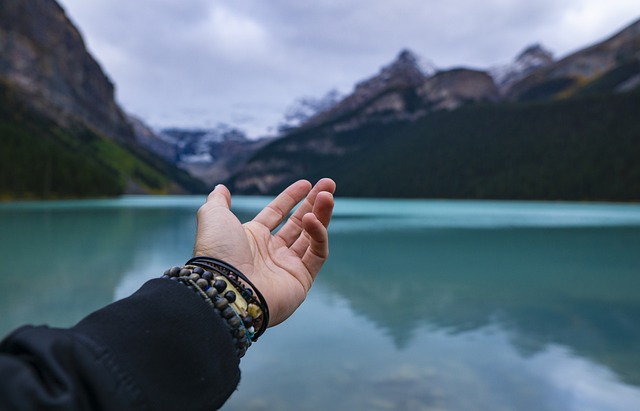 a hand inviting you to a lake